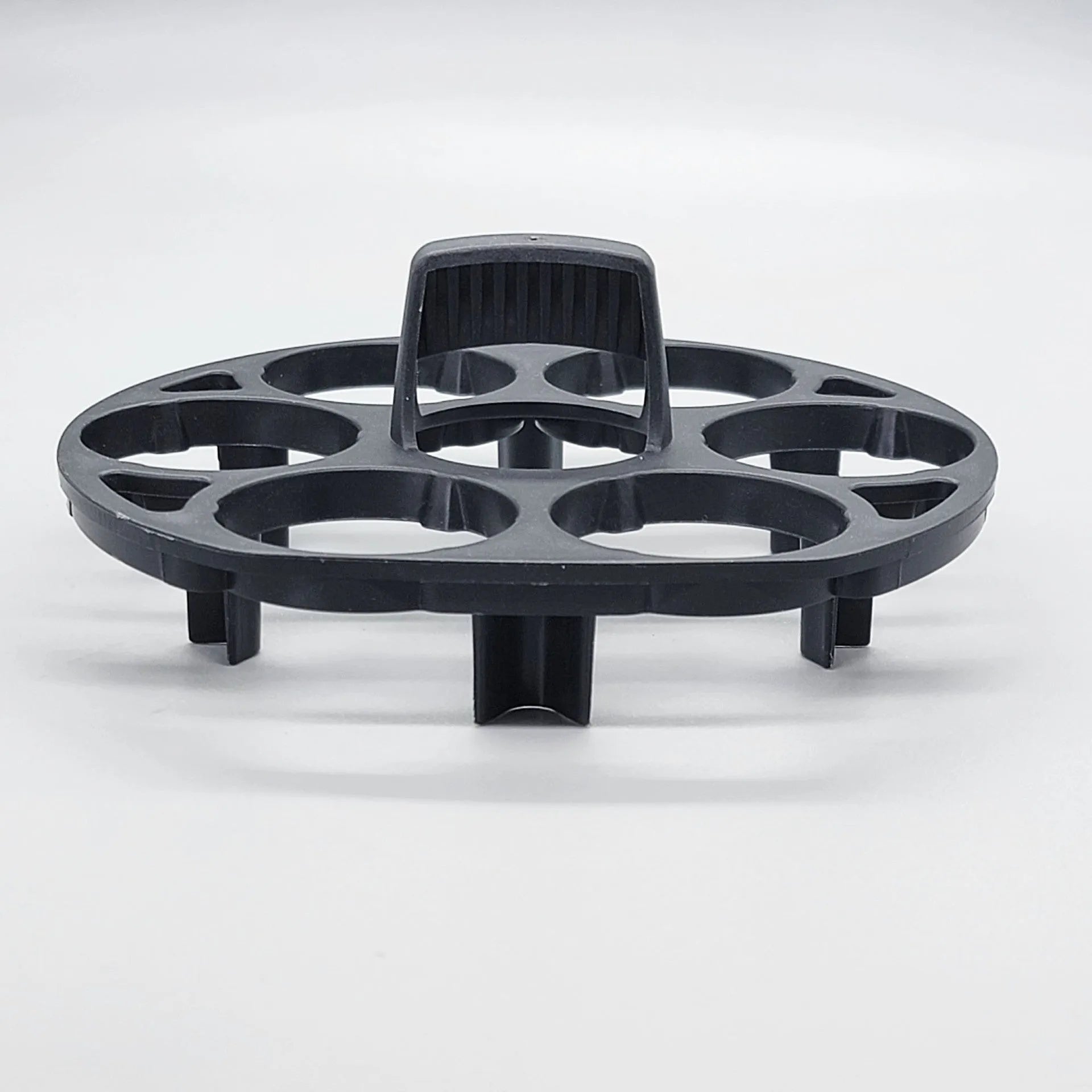 A black plastic egg holder rack for kitchen cooking machine storage, shown with dimensions.