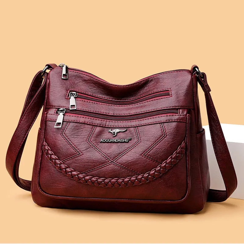 Soft PU leather women's shoulder bag with crossbody strap in black colour