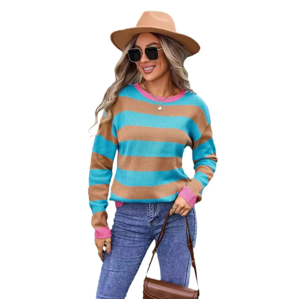 Women's loose fit long sleeve round neck sweater in a striped pattern, shown in a blue colour option.