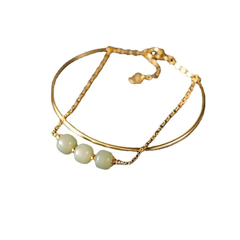 Jade lucky beads bracelet for women with gold inlay detailing showing single, double and three beads versions