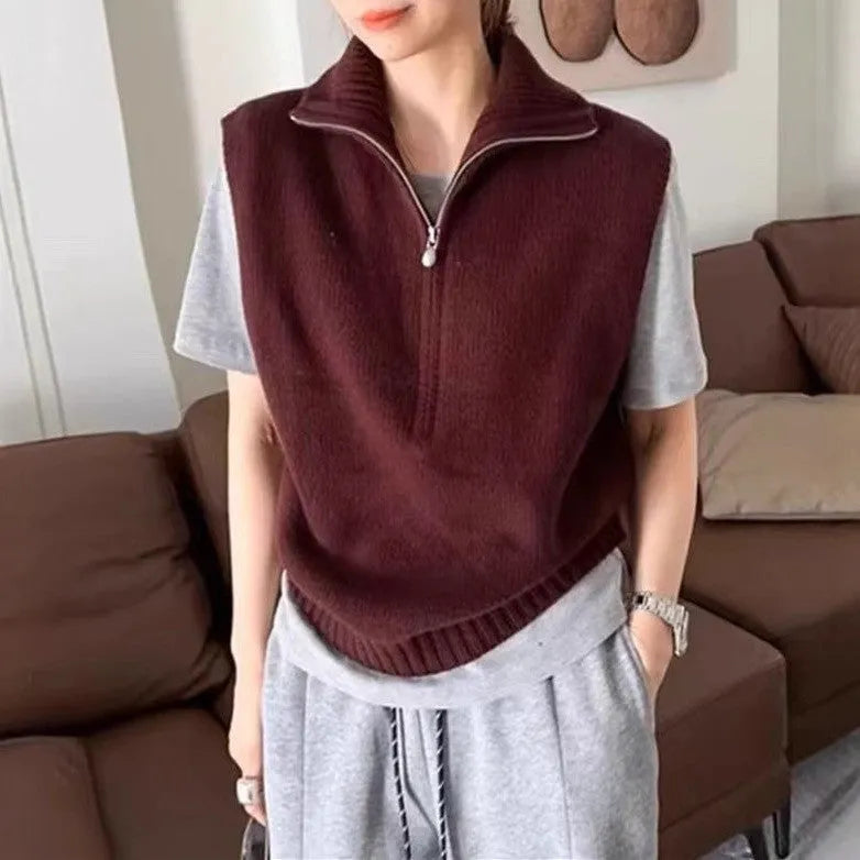 Retro half-zip sleeveless knitted vest in mesh polyester shown in a solid colour with a 3D texture.