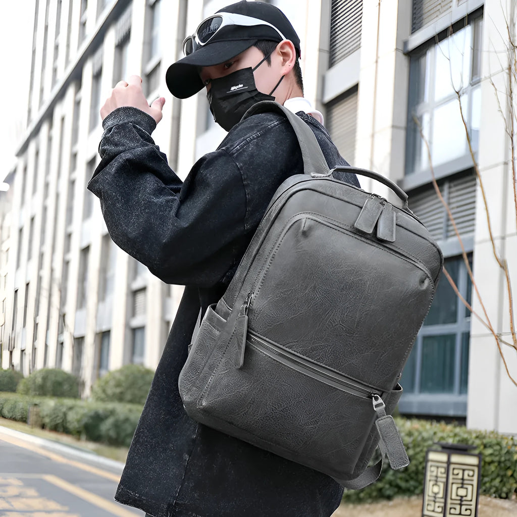 Men's vintage PU leather backpack in gray, 20-35L, with air cushion belt and patchwork accent