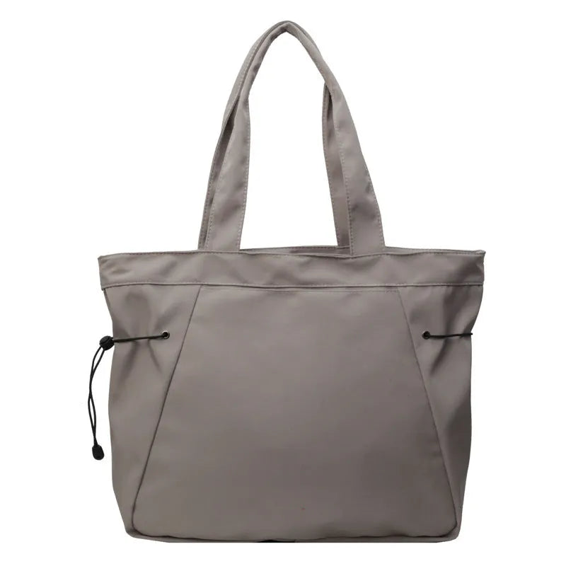 Folding Oxford cloth tote bag in multiple colour options showing compact storage design