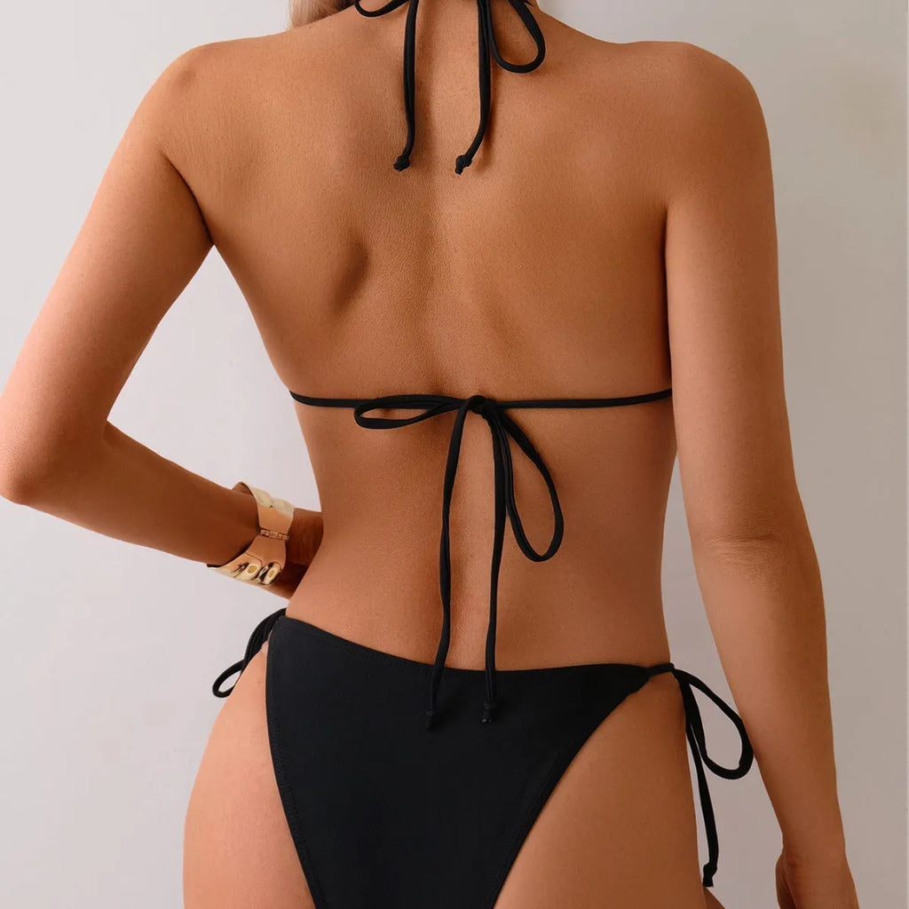 Black women's bikini swimsuit with metal bead decoration on a split-style design