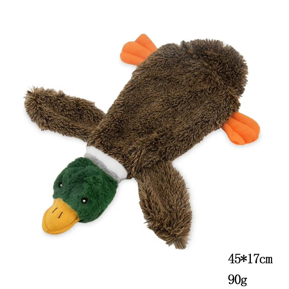 Green plush duck dog toy with stuffless design, squeakers in head and tail, cavity for bottle insertion