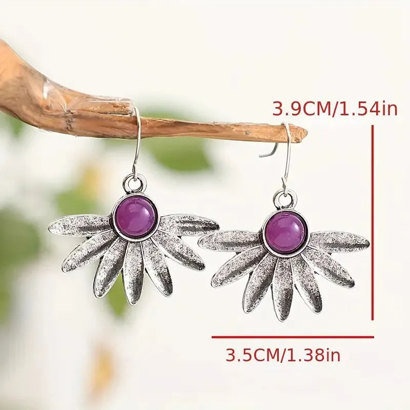 Purple resin bohemian earrings with animal zodiac design and floral elements on alloy settings