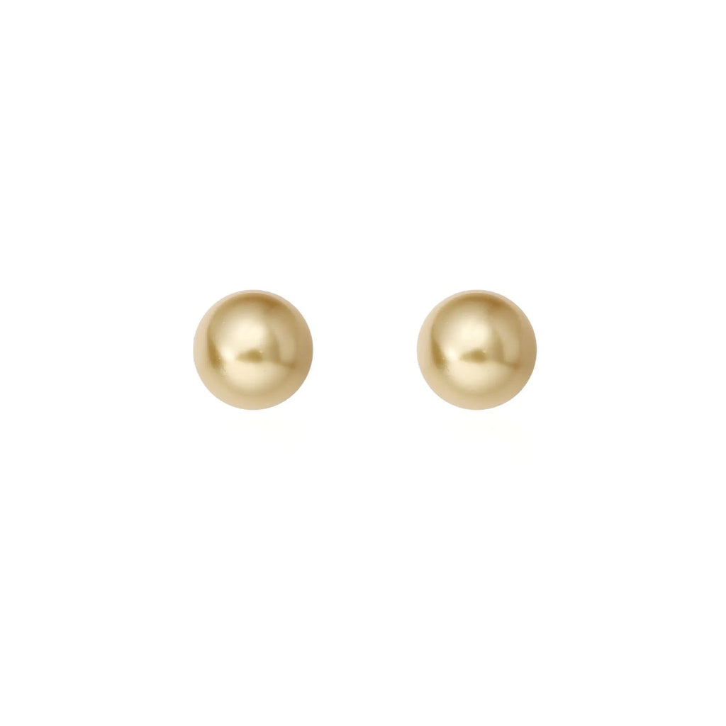 A pair of large pearl stud earrings with an eight-point star geometric setting in silver.