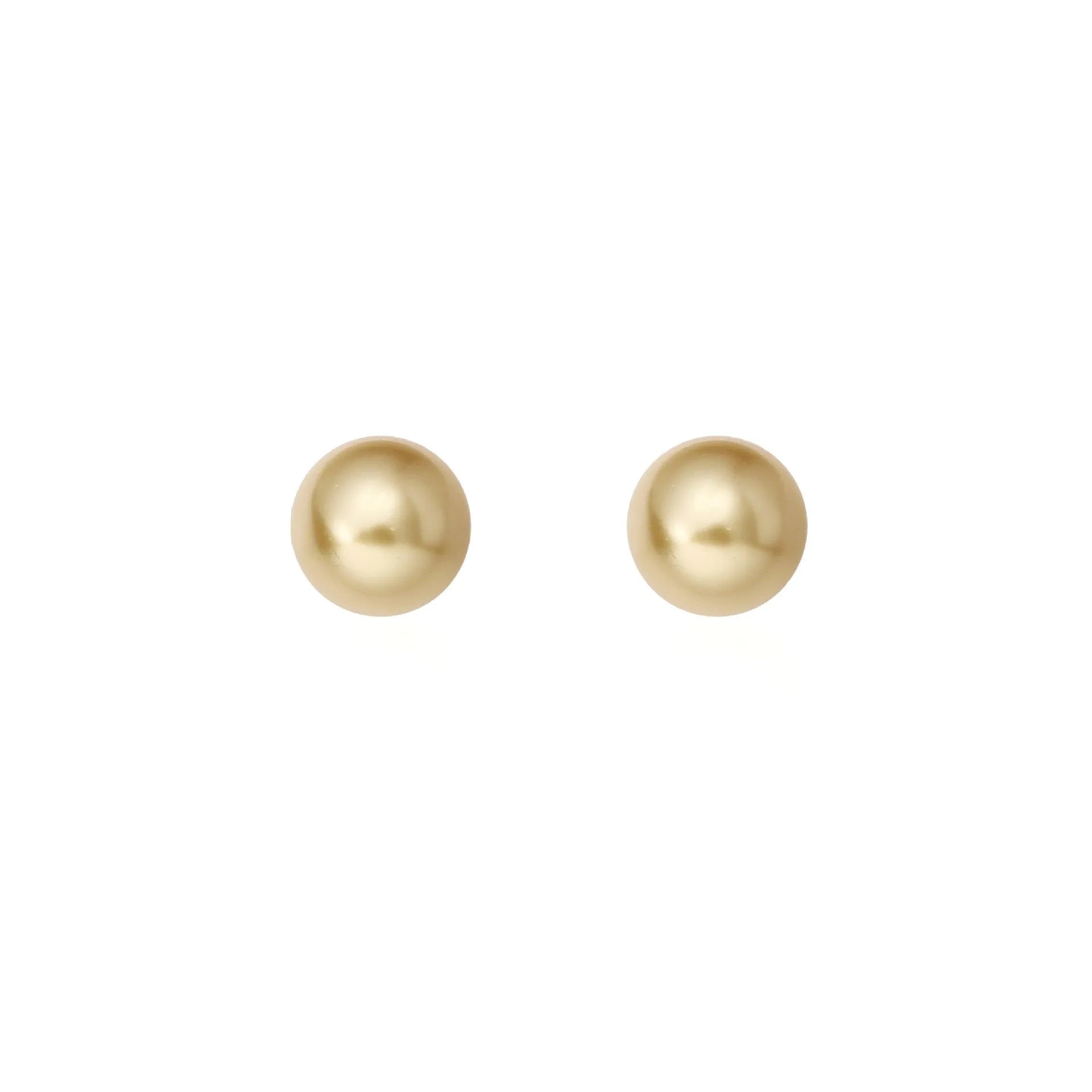 A pair of large pearl stud earrings with an eight-point star geometric setting in silver.