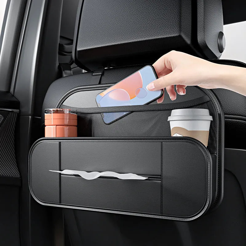 Black leather car seat rear storage bag attached to a vehicle seat, showing its storage box shape.