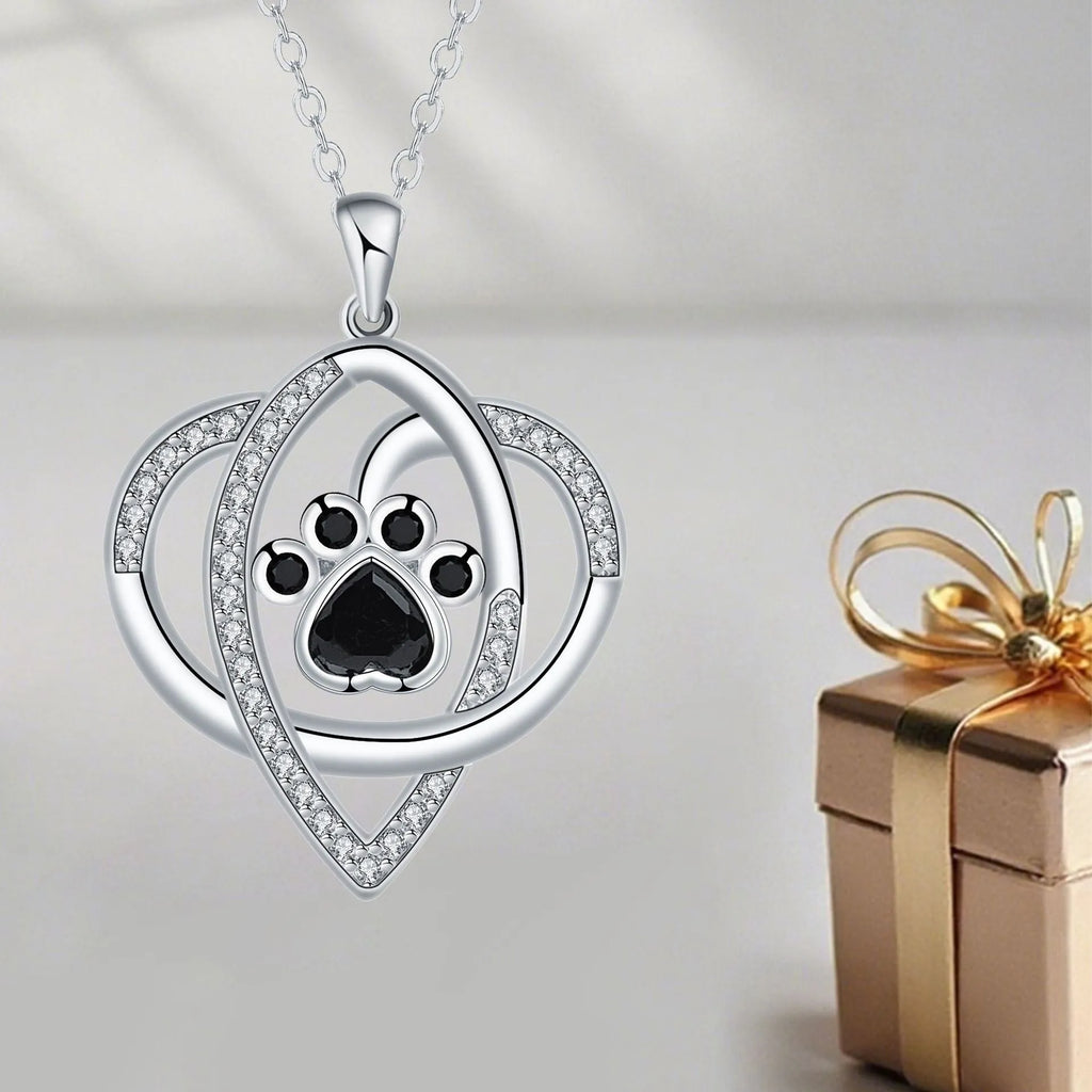 Silver tone necklace with cat and dog paw print pendant on cross chain for women