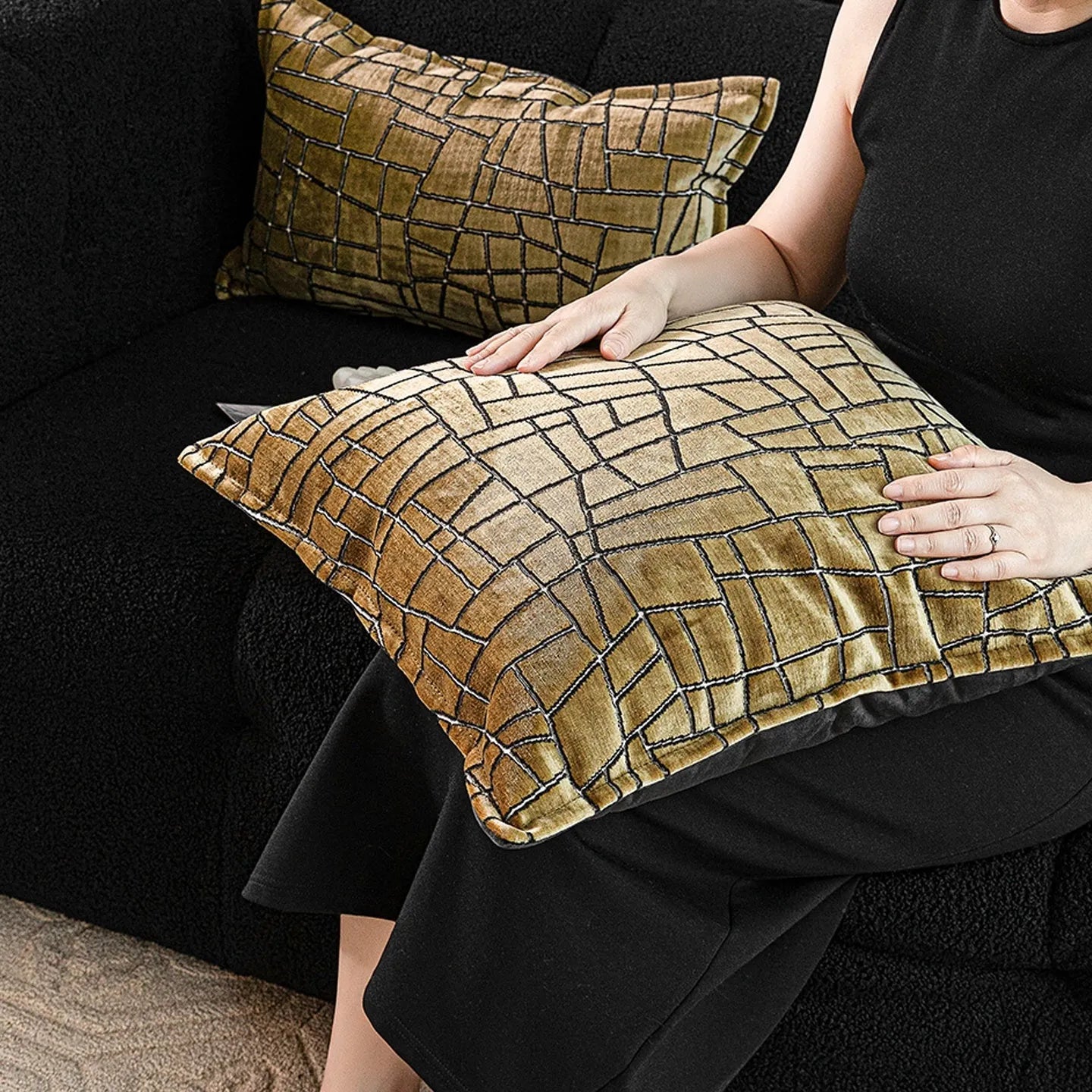 Gold geometric abstract pattern on a square polyester cushion cover and a lumbar pillow.