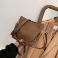 Retro woven PU leather crossbody bucket bag in khaki colour showing adjustable strap and bucket shape