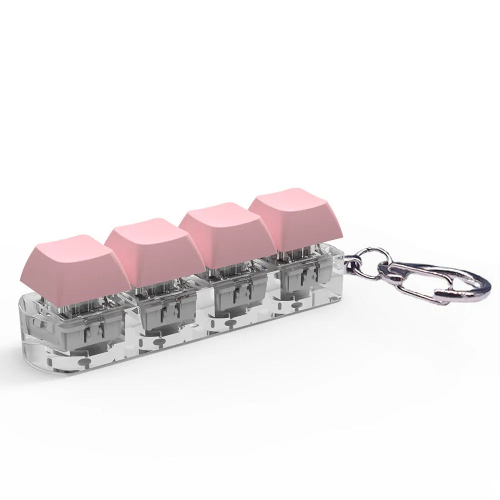 Compact 4-key mechanical keyboard switch tester on a desk, showing coloured ABS plastic construction.
