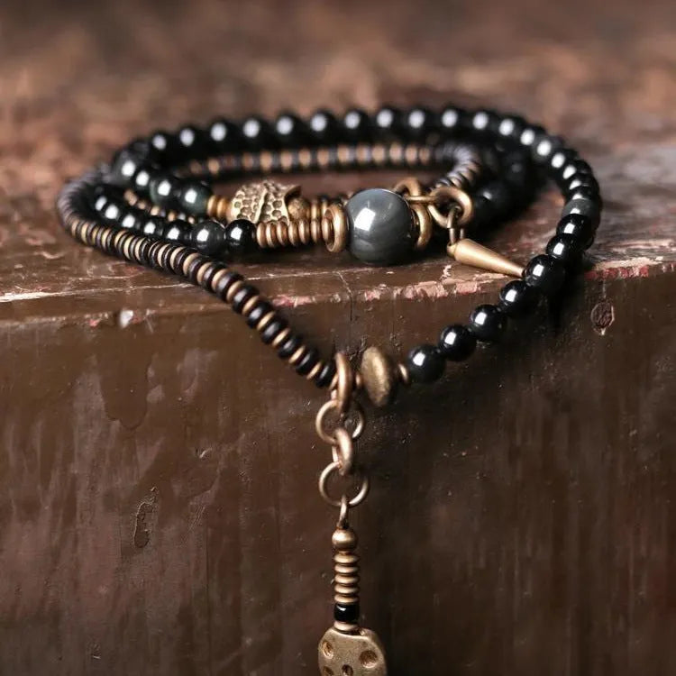 Black geometric layered beaded bracelet with adjustable sizing for unisex wear