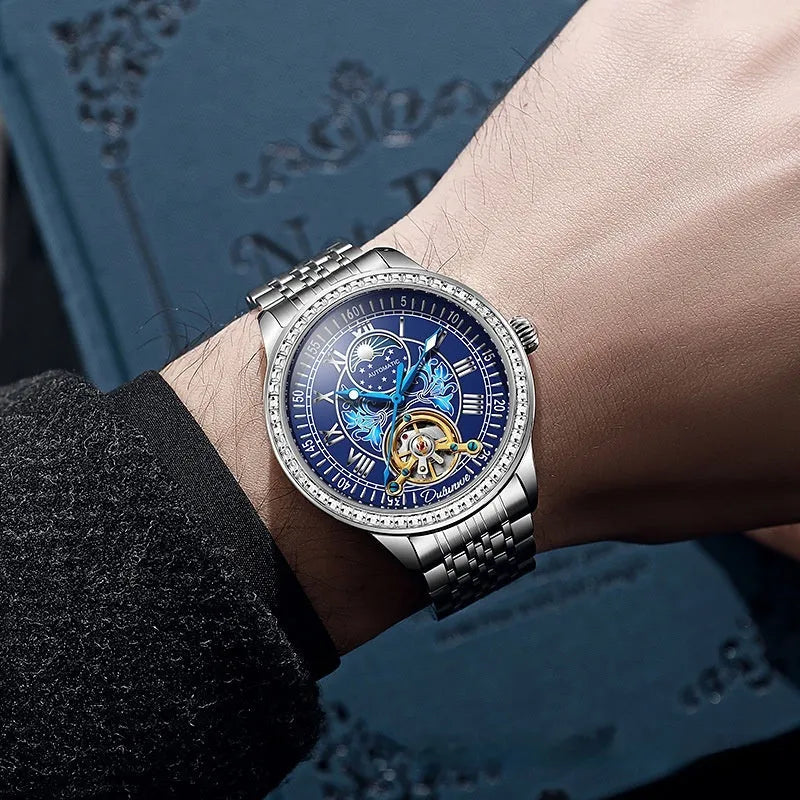Men's mechanical watch with transparent case back showing movement, stainless steel strap with butterfly buckle