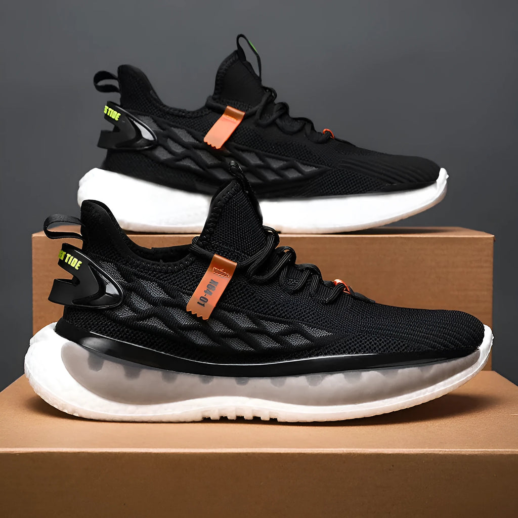 Men's low-top casual sneaker in woven mesh with flat rubber sole and front lace-up closure.