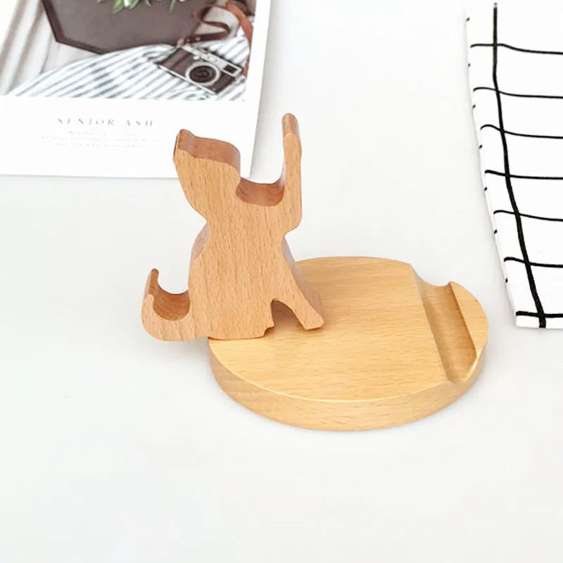 Creative resin animal topper on a beech wood lazy phone holder bracket on a desk