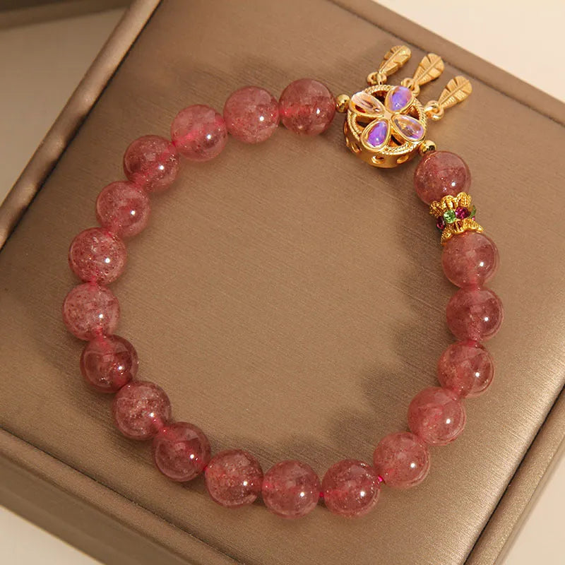Women's strawberry quartz bracelet with four-leaf clover dream catcher and ball charm pendant