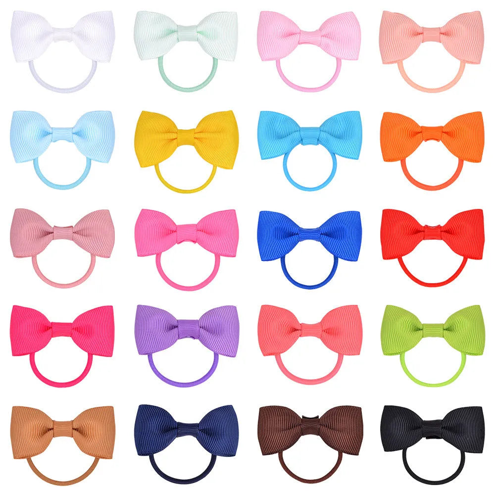 80 piece set of tiny multi-coloured grosgrain ribbon hair bows and matching soft elastic bands for babies and toddlers.