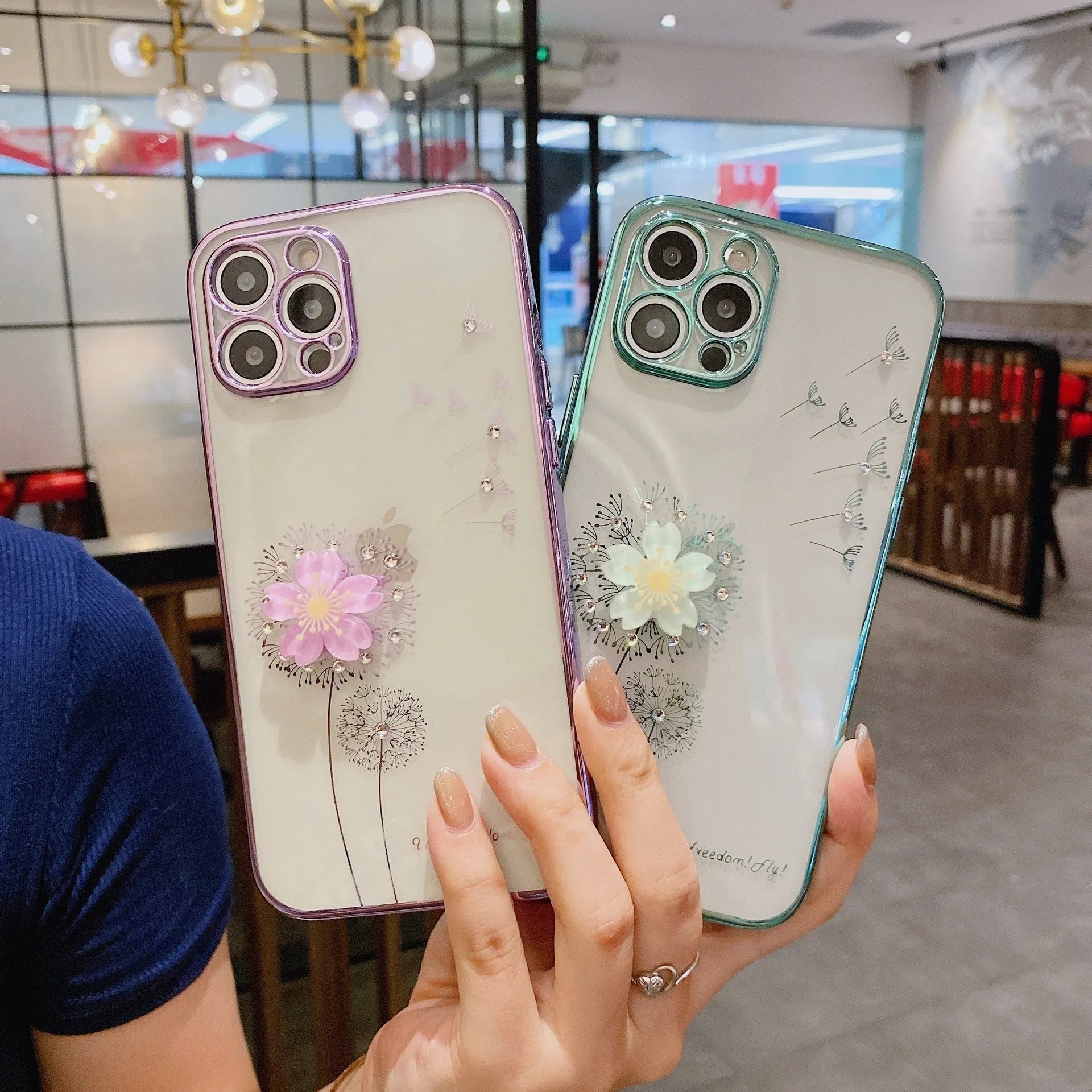 Green iPhone case with 3D flower spin stand and built-in screen protector shown on iPhone 13