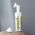 Pet cleaning kit with bottle of paw foam, bottle of ear liquid, and packs of pet wipes.