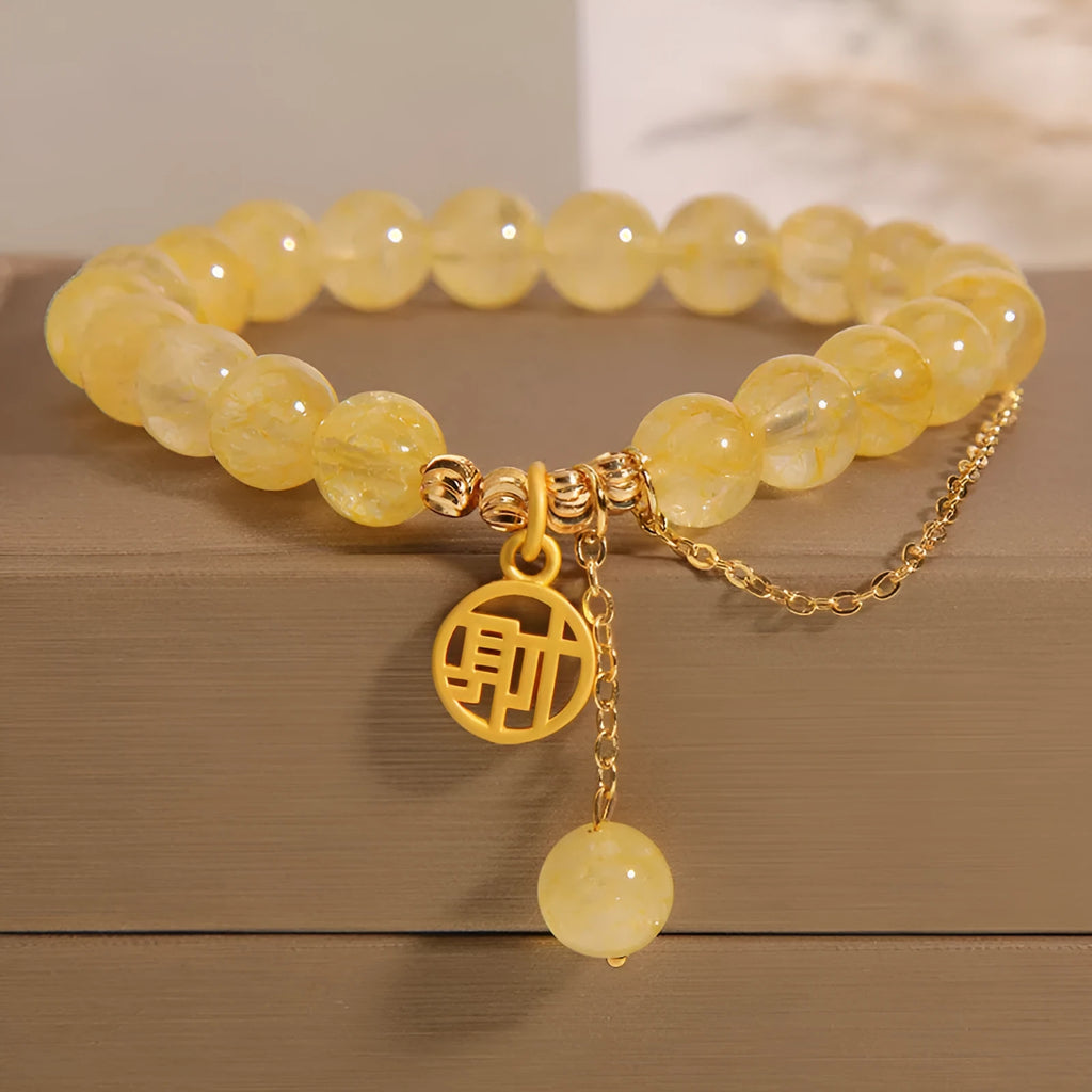 Adjustable natural citrine gemstone bracelet with selectable Chinese 'Cai' or 'Fu' character charm and tassel.