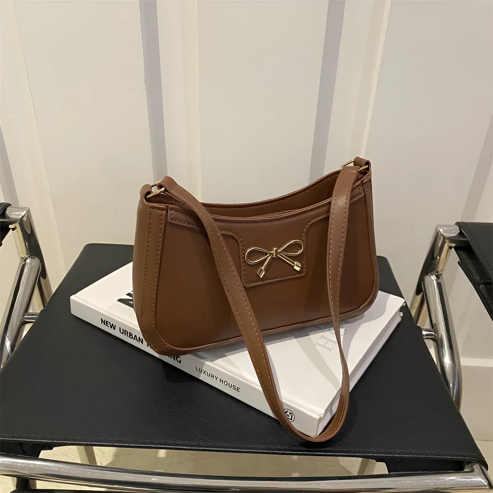 PU leather shoulder bag with bow detail in horizontal square shape showing rose red colour option