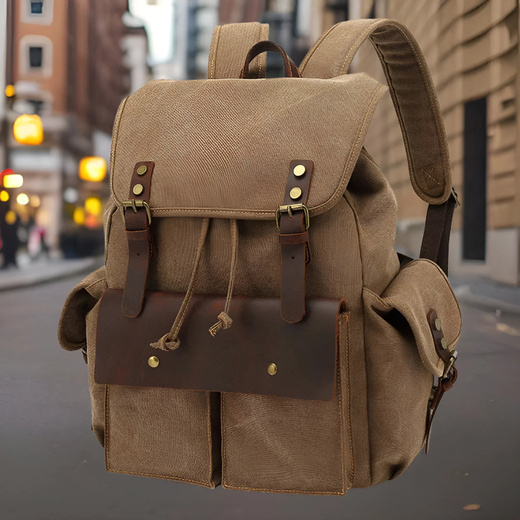Retro canvas backpack in army green with antique bronze hardware and 16-inch laptop compartment