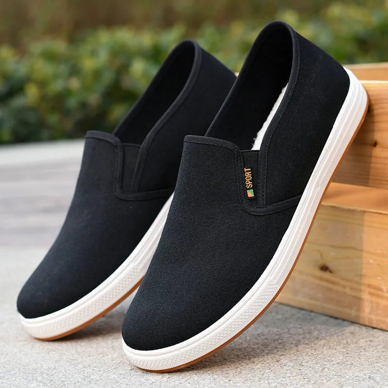 Men's black and blue canvas slip-on shoes with round toe and low-top design