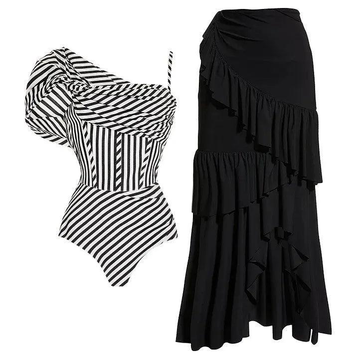 Women's striped one-piece swimsuit with a black ruffle skirt, shown on a mannequin.