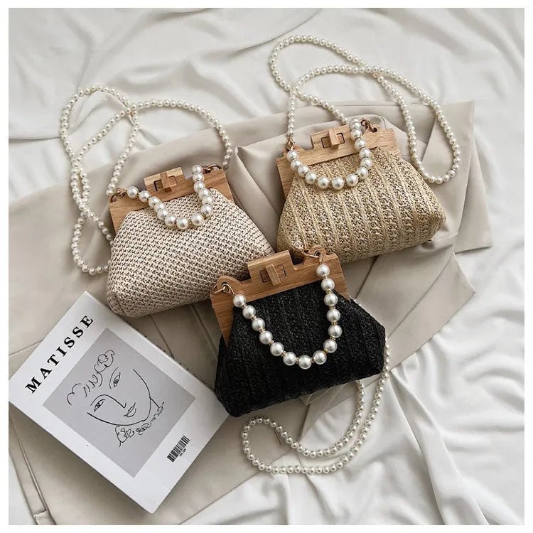Women's straw woven shoulder bag with pearl chain strap in horizontal square shape
