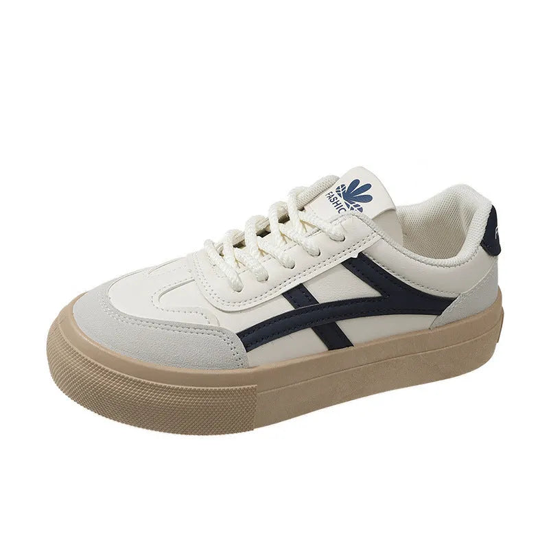 Classic brown and blue low-top casual trainers with flat rubber sole and lace-up front.