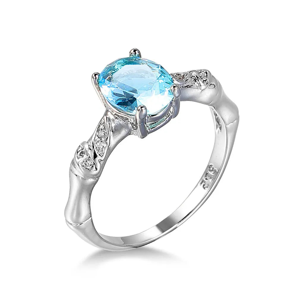Ocean blue zircon copper ring with geometric shape and electroplated finish in women's sizes No 6 to No 10