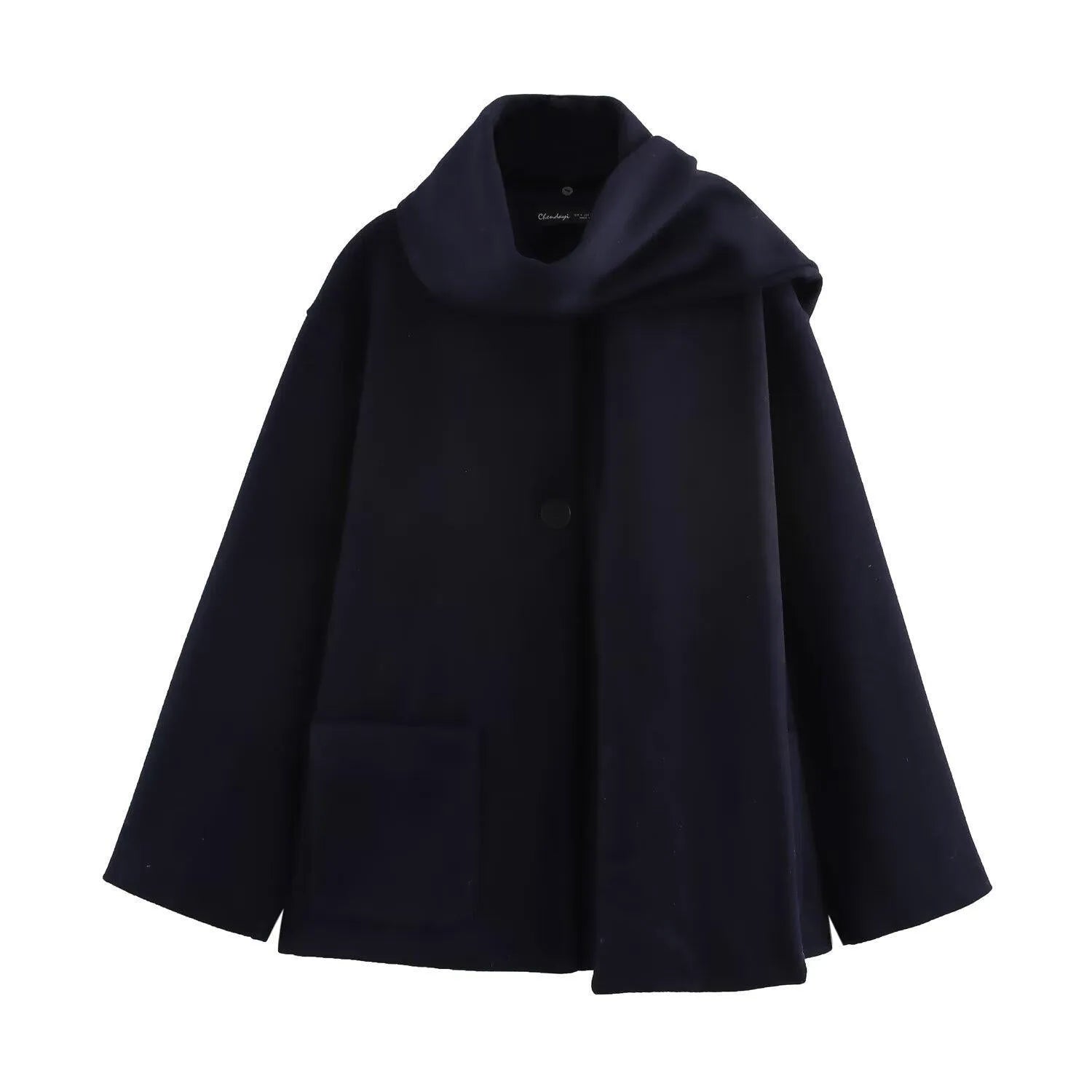 Women's long black polyester blend overcoat with a detachable artificial fur collar, showing pocket detail and street-fashion fit.