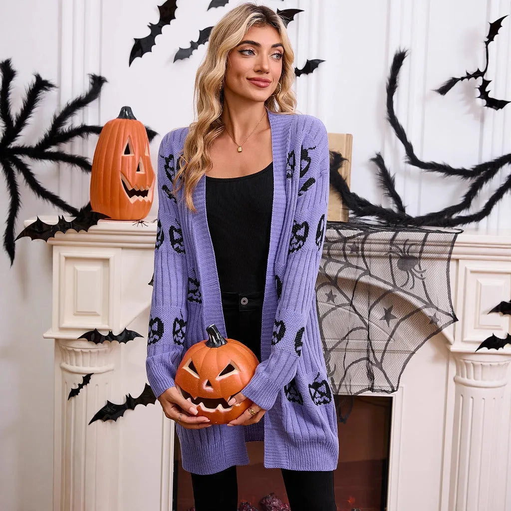 Women's black Halloween cardigan with orange pumpkin head jacquard knit pattern.