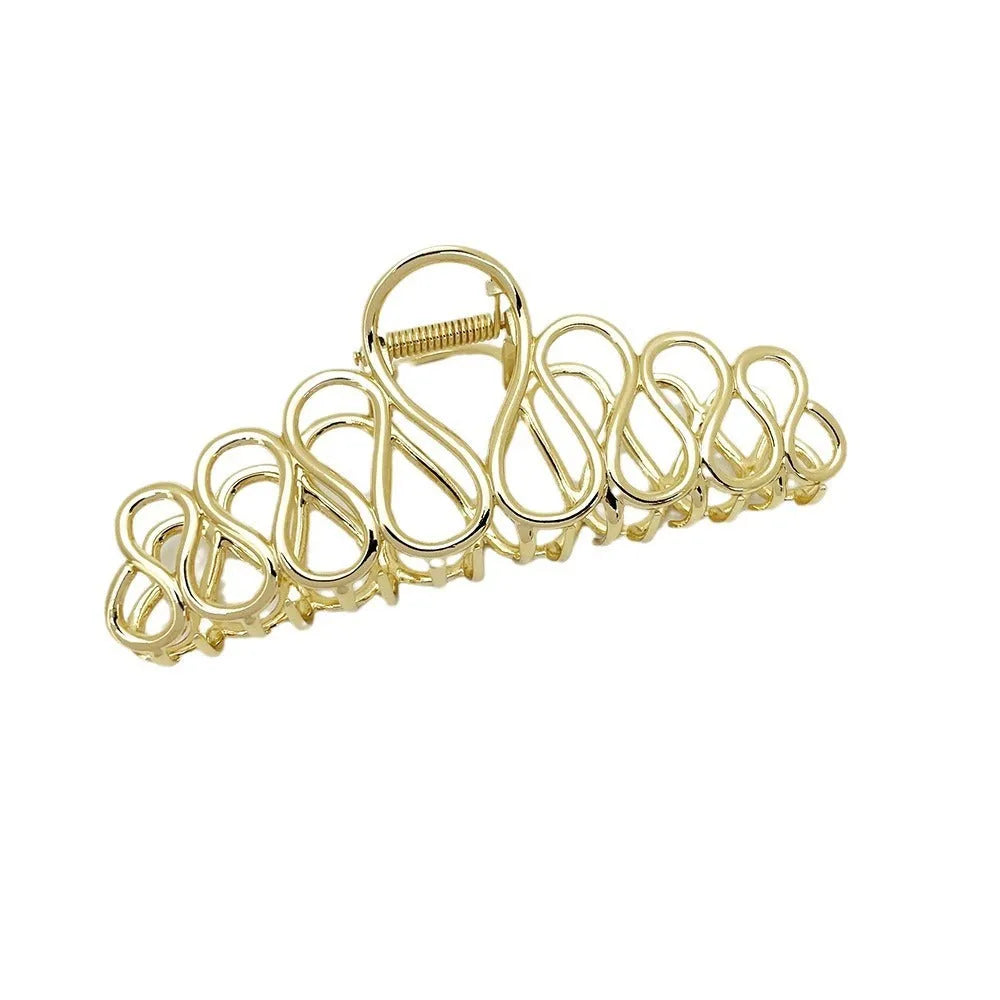 Large minimalist hair clip for updo hairstyles in gold electroplated alloy with tassel accents