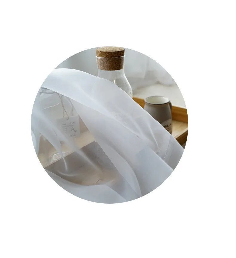 Pure colour cotton and linen vertical curtain in a modern simple style hanging on a window.