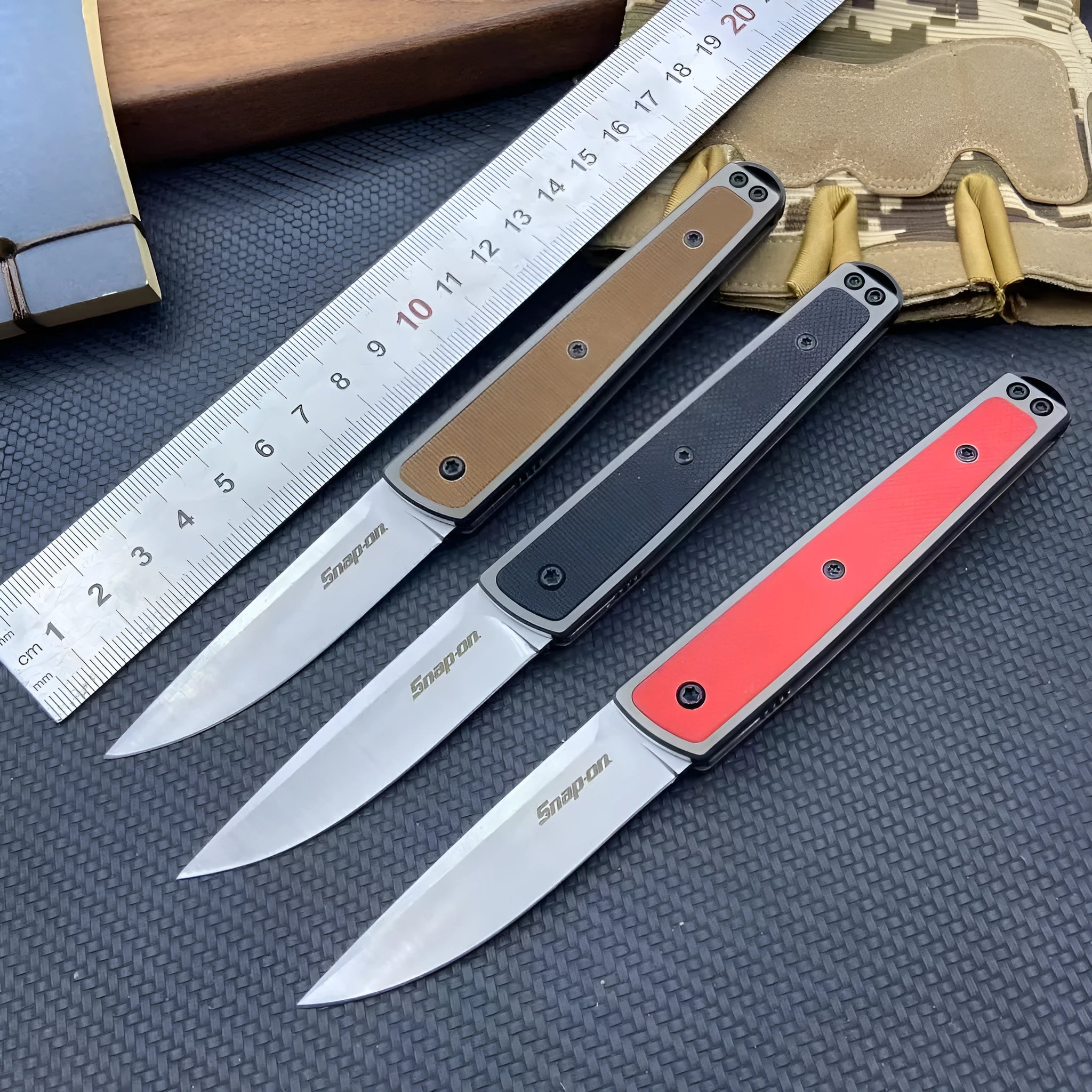 Folding fruit knife with stainless steel blade in black, brown, or red colour options