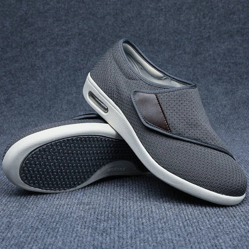 Leisure shoes for elderly with Velcro strap, textile and synthetic leather upper, round toe.