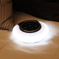 Folding Bluetooth speaker desk lamp with touch controls showing white, yellow, and blue LED lighting options