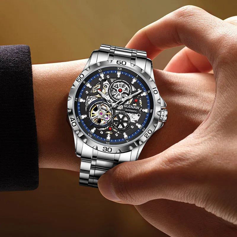 Silver automatic mechanical watch with hollow-out design showing movement through transparent back