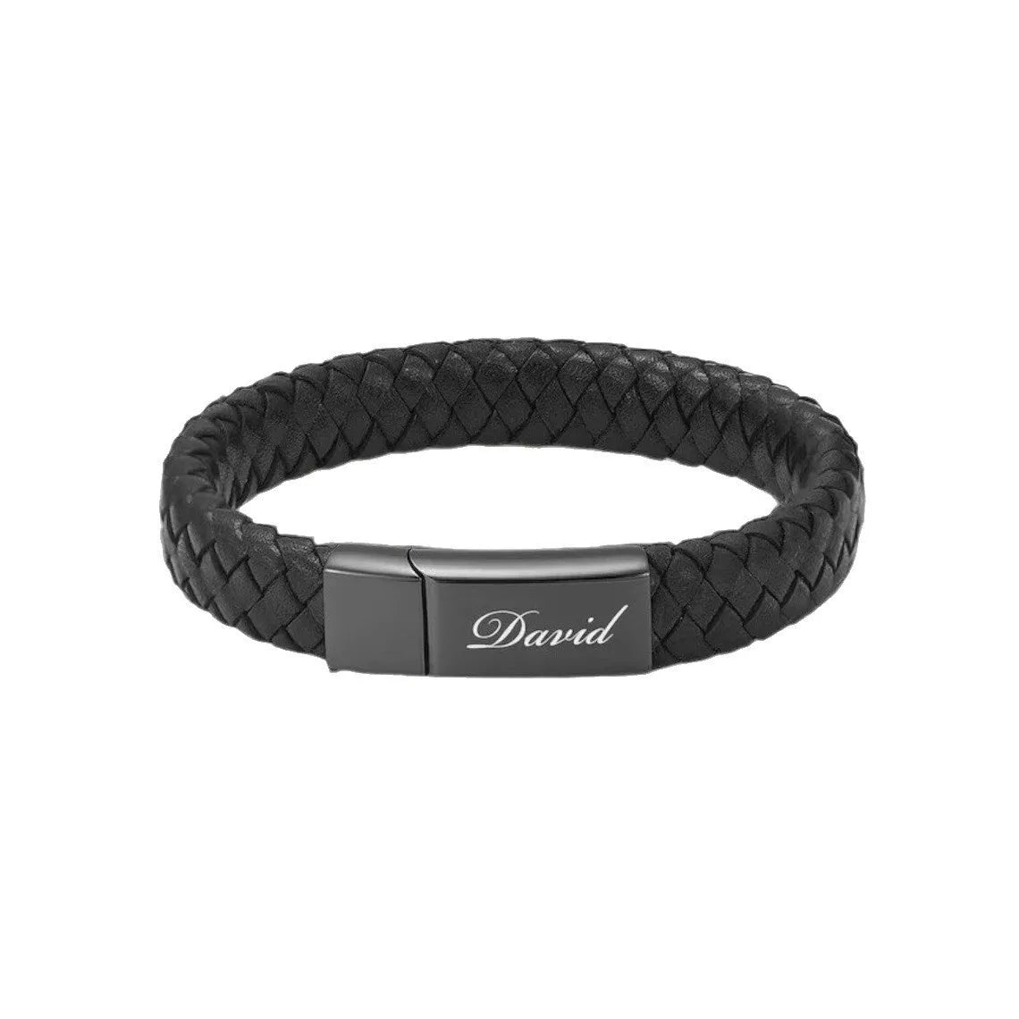 Black leather and stainless steel casket bracelet with engraved text on a gift box.