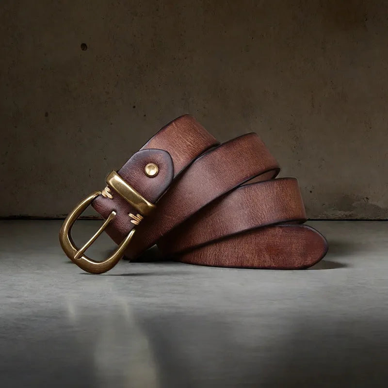 Men's brown genuine cowhide leather belt with a copper pin buckle on a jeans background.