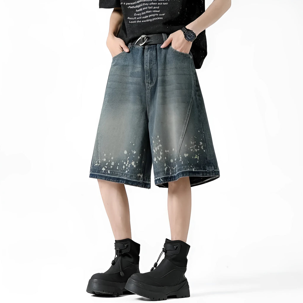 Men's retro blue denim shorts with ripped detailing and splash ink patterns in straight cut design