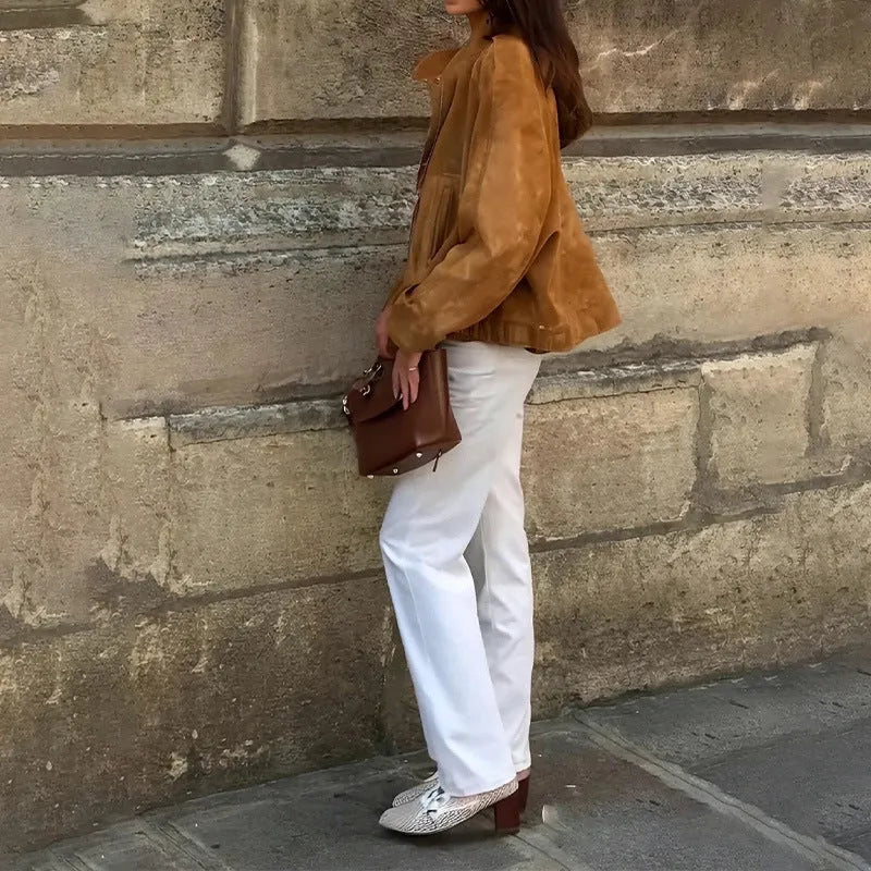 Retro-style loose-fit solid colour jacket with long sleeves on a hanger.