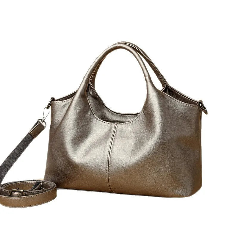 Women's soft genuine leather cross-body bag in one of seven colours with large capacity.