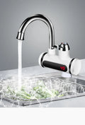 White electric water heater tap with digital temperature display for kitchen sink installation