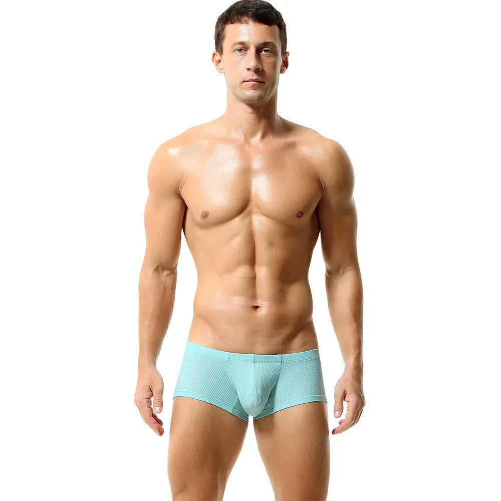 Men's low waist boxers in solid colour nylon fabric on a white background.