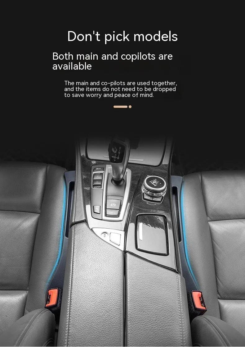 Black plastic car seat gap storage box with handle between vehicle seats