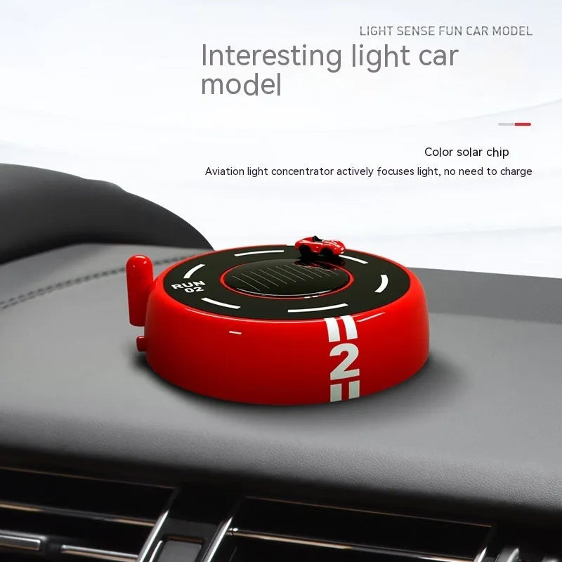 Round car-shaped solar-powered aroma diffuser ornament for vehicle interiors in black, red or white